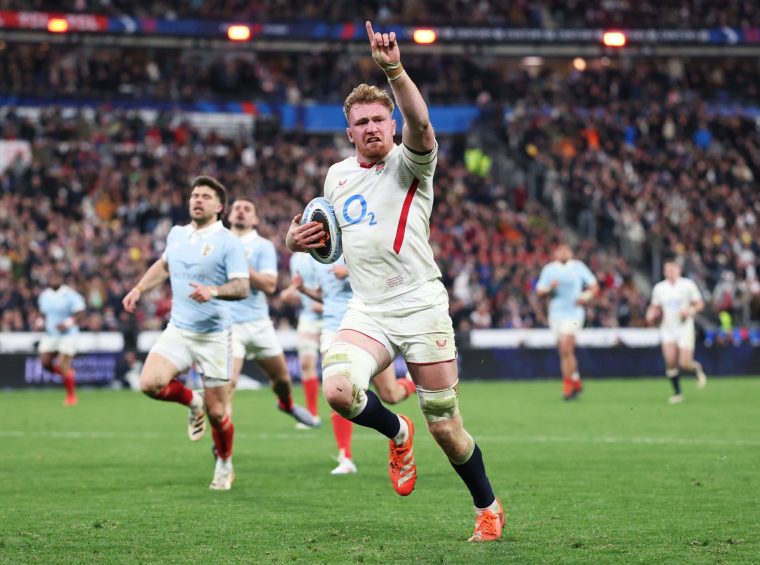 PARIS, FRANCE - MARCH 14: Ollie Chessum of England celebrates as he runs in to score his team's fifth try during the Guinness Six Nations 2026 match between France and England at Stade de France on March 14, 2026 in Paris, France. (Photo by Dan Mullan - RFU/The RFU Collection via Getty Images)