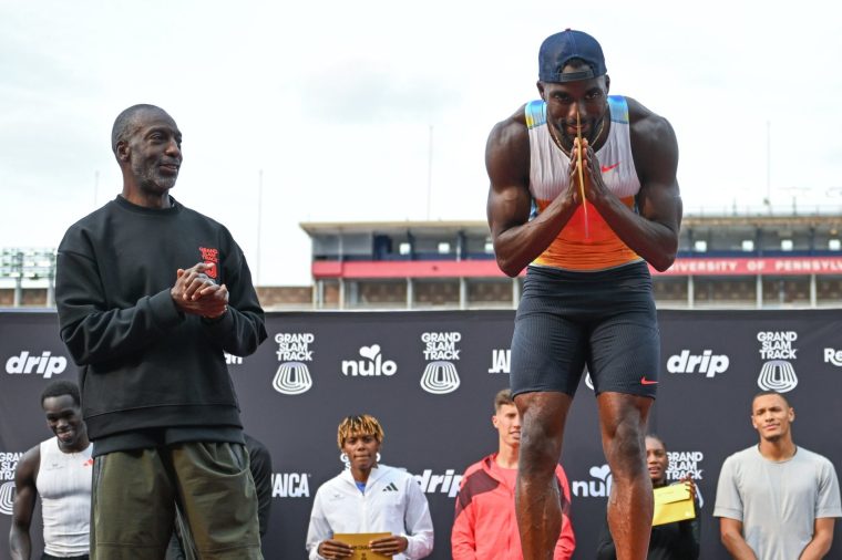 PHILADELPHIA, UNITED STATES JUNE 1: American former Olympic champion sprinter Michael Johnson, the founder and CEO of Grand Slam Track, with Kenny Bednarek of the United States, the winner of the Men's Short Sprint category, during the Awards Ceremony, on the second day of the third leg of the Grand Slam Track Series, held at the historic Franklin Field in Philadelphia, Pennsylvania, United States, on June 1, 2025. (Photo by Artur Widak/Anadolu via Getty Images)