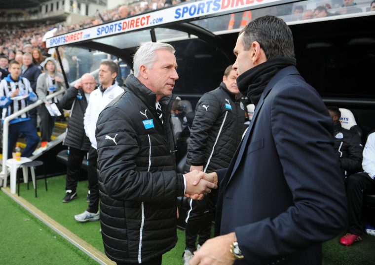 NEWCASTLE UPON TYNE, ENGLAND - FEBRUARY 01: (L-R) Opposing managers Alan Pardew the Newcastle manager Gus Poyet the Sunderland manager shake hands prior to kickoff during the Barclays Premier League match between Newcastle United and Sunderland at St James' Park on February 1, 2014 in Newcastle upon Tyne, England. (Photo by Michael Regan/Getty Images)