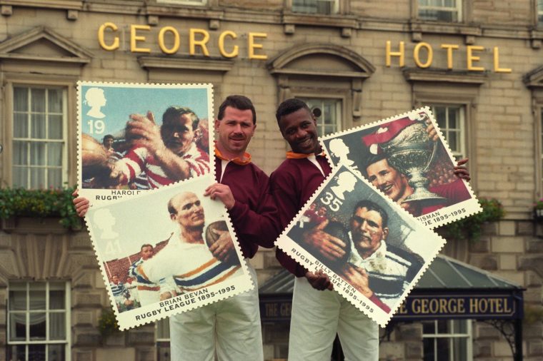 Rugby League stars Greg Austin (left) and Ian Thomas with the new Royal Mail stamps that celebrate the centenary of the sport.