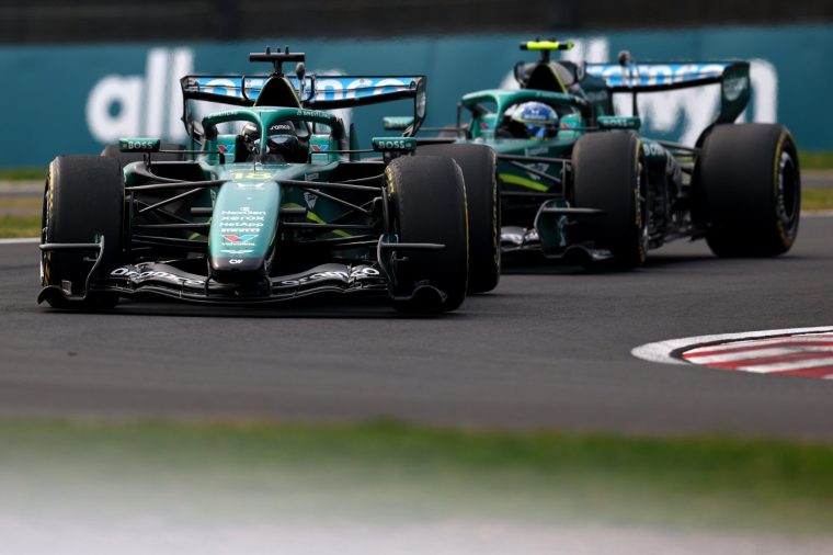 SUZUKA, JAPAN - MARCH 29: Lance Stroll of Canada driving the (18) Aston Martin F1 Team AMR26 Honda leads Fernando Alonso of Spain driving the (14) Aston Martin F1 Team AMR26 Honda on track during the F1 Grand Prix of Japan at Suzuka Circuit on March 29, 2026 in Suzuka, Japan. (Photo by Simon Galloway/LAT Images)