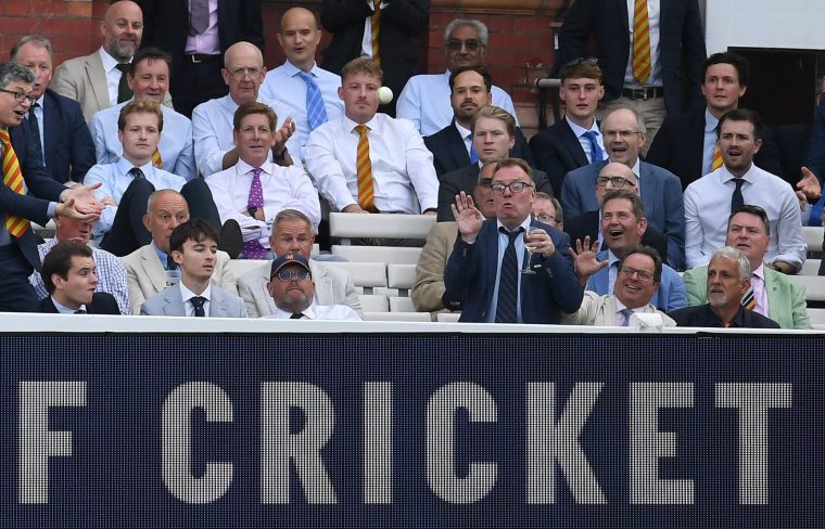LONDON, ENGLAND - JULY 16: A spectator reacts as a six is hit into the pavilion during the Men's Vitality Blast match between Middlesex and Surrey at Lord's Cricket Ground on July 16, 2025 in London, England. (Photo by Philip Brown - ECB/ECB via Getty Images)