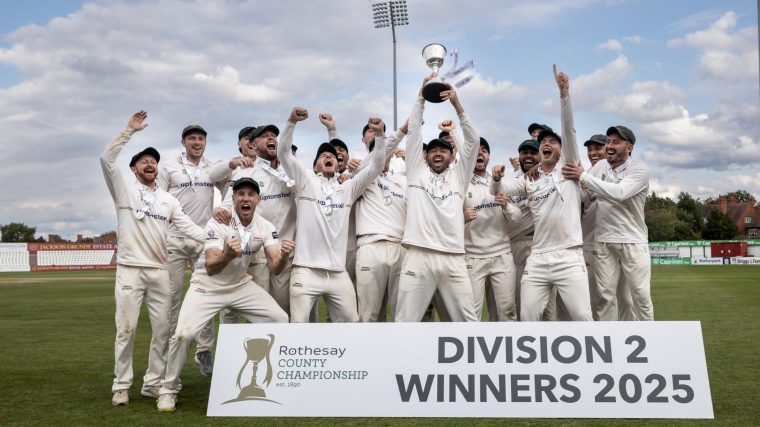 NORTHAMPTON, ENGLAND - SEPTEMBER 27: Captain Ian Holland of Leicestershire lifts the County Championship Division Two Trophy aloft surrounded by team mates during Day Four of the Rothesay County Championship Division Two match between Northamptonshire and Leicestershire at The County Ground on September 27, 2025 in Northampton, England. (Photo by Andy Kearns/Getty Images)