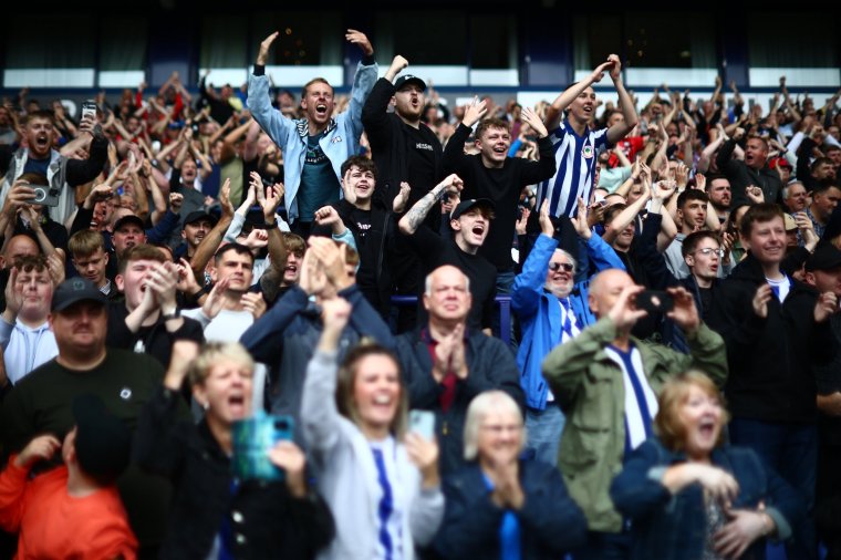 BOLTON, ENGLAND - AUGUST 19: Wigan Athletic fans celebrate their win after the Sky Bet League One match between Bolton Wanderers and Wigan Athletic at University of Bolton Stadium on August 19, 2023 in Bolton, England. (Photo by Ryan Jenkinson/MB Media/Getty Images)