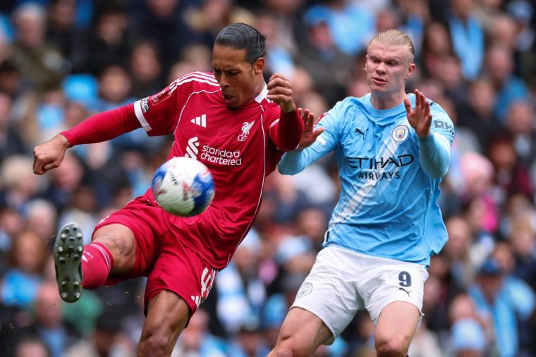 MANCHESTER, ENGLAND - APRIL 04: Virgil van Dijk of Liverpool clears the ball under pressure from Erling Haaland of Manchester City during the Emirates FA Cup Quarter Final match between Manchester City and Liverpool on April 04, 2026 in Manchester, England. (Photo by Marc Atkins/Getty Images)