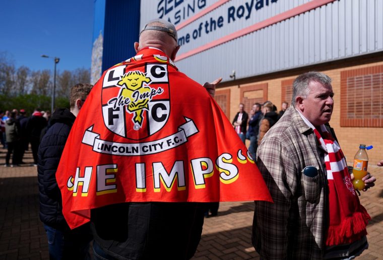 Lincoln City fans outside the ground ahead of the Sky Bet League One match at the Select Car Leasing Stadium, Reading. Picture date: Monday April 6, 2026. PA Photo. Photo credit should read: Jacob King/PA Wire. RESTRICTIONS: EDITORIAL USE ONLY No use with unauthorised audio, video, data, fixture lists, club/league logos or "live" services. Online in-match use limited to 120 images, no video emulation. No use in betting, games or single club/league/player publications.