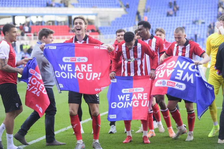 READING, ENGLAND - APRIL 6: Ryley Towler of Lincoln City celebrates promotion following the Sky Bet League One match between Reading and Lincoln City at Select Car Leasing Stadium on April 6, 2026 in Reading, United Kingdom. (Photo by Andrew Vaughan/Getty Images)