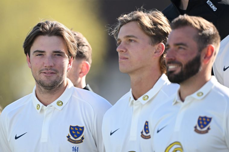 HOVE, ENGLAND - MARCH 26: James Coles of Sussex CCC (L) looks on during a Sussex team photo at the 1st Central County Ground on March 26, 2026 in Hove, England. (Photo by Mike Hewitt/Getty Images)