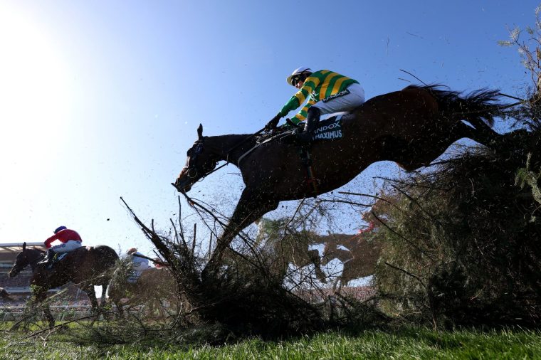 LIVERPOOL, ENGLAND - APRIL 05: I Am Maximus ridden by jockey Paul Townsend goes over The Chair Fence before finishing second in the Randox Grand National Handicap Chase during Grand National Day at Aintree Racecourse on April 05, 2025 in Liverpool, England. (Photo by Michael Steele/Getty Images)