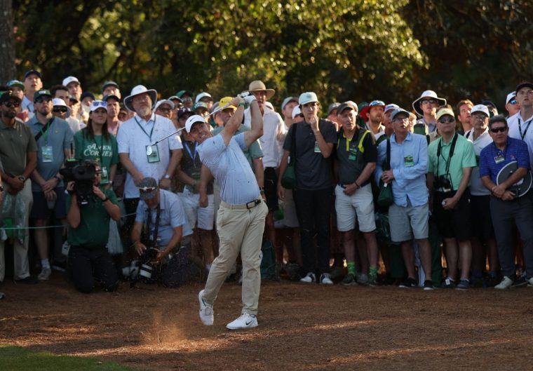 Golf - The Masters - Augusta National Golf Club, Augusta, Georgia, U.S. - April 12, 2026 Northern Ireland's Rory McIlroy hits his approach from the pine straw on the 18th hole during the final round REUTERS/Mike Segar