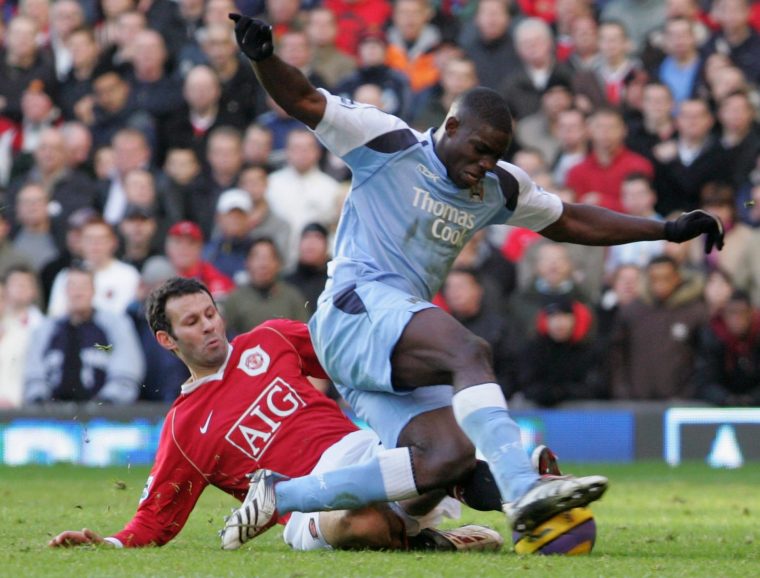 MANCHESTER, ENGLAND - DECEMBER 9: Ryan Giggs of Manchester United clashes with Micah Richards of Manchester City during the Barclays Premiership match between Manchester United and Manchester City at Old Trafford on December 9 2006 in Manchester, England. (Photo by Chris Coleman/Manchester United via Getty Images)