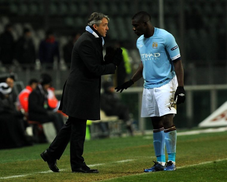 TURIN, ITALY - DECEMBER 16: Head coach Roberto Mancini of Manchester City gives instructions to Micah Richards during the UEFA Europa League group A match between Juventus FC and Manchester City at Stadio Olimpico di Torino on December 16, 2010 in Turin, Italy. (Photo by Massimo Cebrelli/Getty Images)