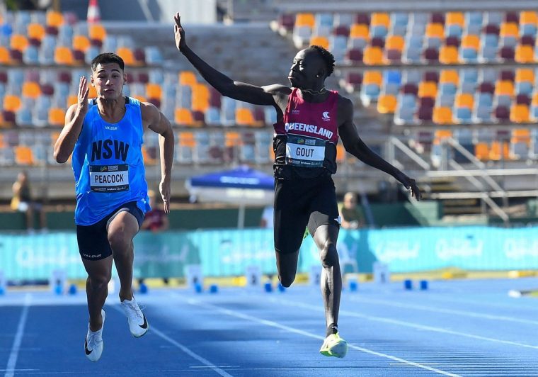 Athletics - Australian Athletics Junior Championship - Brisbane, Australia - April 18, 2026 Gout Gout waves while winning the under 20s 100m final Jono Searle/AAP Image via REUTERS ATTENTION EDITORS - THIS IMAGE WAS PROVIDED BY A THIRD PARTY. NO RESALES. NO ARCHIVES. AUSTRALIA OUT. NEW ZEALAND OUT