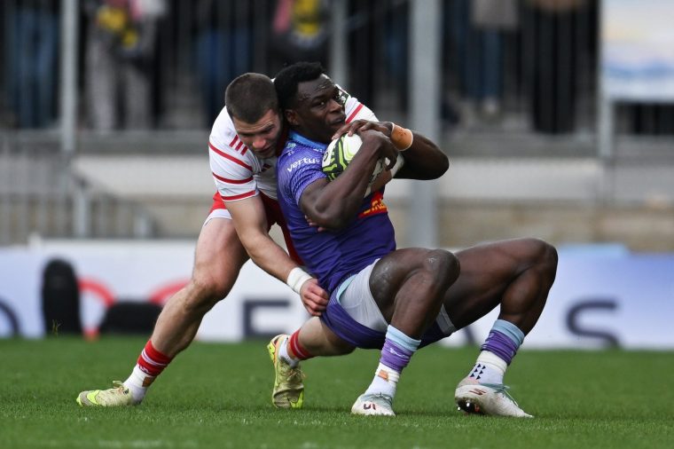 England , United Kingdom - 4 April 2026; Paul Brown-Bampoe of Exeter Chiefs is tackled by Diarmuid Kilkallen of Munster during the EPCR Challenge Cup match between Exeter Chiefs and Munster at Sandy Park in Exeter, England. (Photo By Paul Phelan/Sportsfile via Getty Images)
