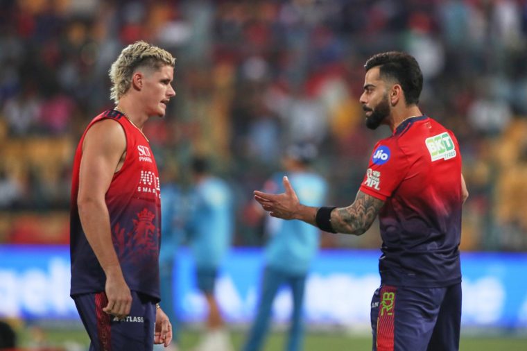 Royal Challengers Bengaluru's Virat Kohli talks to Jacob Bethell during the warm up before the start of the Indian Premier League cricket match between Royal Challengers Bengaluru and Gujarat Titans in Bengaluru, India, Friday, April 24, 2026. (AP Photo)