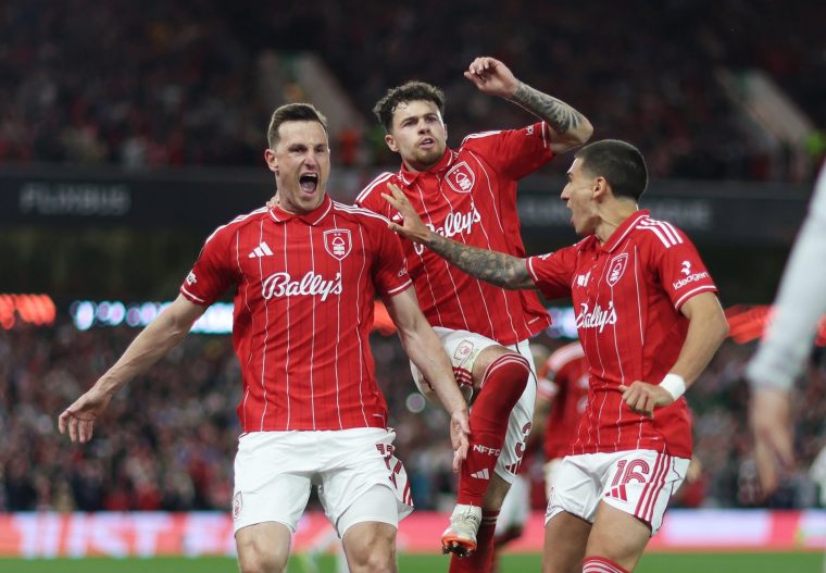 NOTTINGHAM, ENGLAND - APRIL 30: Chris Wood of Nottingham Forest celebrates scoring his team's first goal from the penalty spot with Neco Williams and Nicolas Dominguez during the UEFA Europa League 2025/26 Semi-Final First Leg match between Nottingham Forest FC and Aston Villa FC at City Ground on April 30, 2026 in Nottingham, England. (Photo by Naomi Baker - UEFA/UEFA via Getty Images)