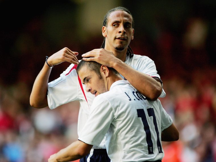 CARDIFF, UNITED KINGDOM - SEPTEMBER 03: Joe Cole of England celebrates scoring the first goal with team mate Rio Ferdinand during the 2006 World Cup Qualifying match between Wales and England at the Millennium Stadium on September 3, 2005 in Cardiff, Wales. (Photo by Mike Hewitt/Getty Images)