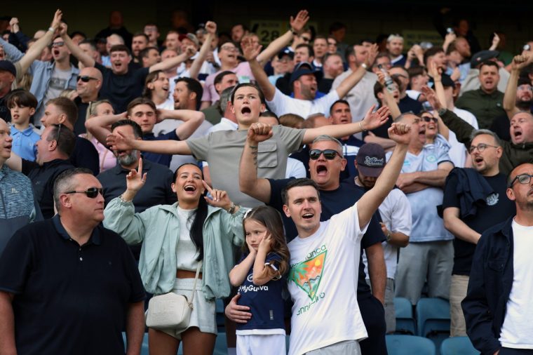 Millwall fans cheer during the Sky Bet Championship match at The Den, London. Picture date: Saturday May 2, 2026. PA Photo. Photo credit should read: Steven Paston/PA Wire. RESTRICTIONS: EDITORIAL USE ONLY No use with unauthorised audio, video, data, fixture lists, club/league logos or "live" services. Online in-match use limited to 120 images, no video emulation. No use in betting, games or single club/league/player publications.