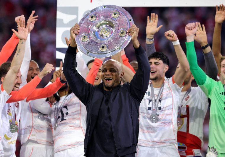 MUNICH, GERMANY - MAY 10: Head coach Vincent Kompany of FC Bayern M??nchen lifts the German Bundesliga trophy Meisterschale during the award ceremony after the Bundesliga match between FC Bayern M??nchen and Borussia M??nchengladbach at Allianz Arena on May 10, 2025 in Munich, Germany. (Photo by Marcel Engelbrecht - firo sportphoto/Getty Images)