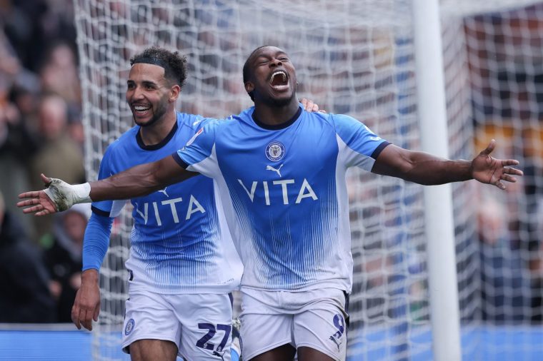 STOCKPORT, ENGLAND - APRIL 03: Isaac 'Tanto' Olaofe of Stockport County celebrates with teammate Odin Bailey after scoring their side's second goal during the Sky Bet League One match between Stockport County FC and Wycombe Wanderers at Edgeley Park on April 03, 2026 in Stockport, England. (Photo by James Gill - Danehouse/Getty Images)