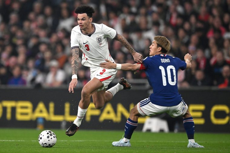 LONDON, ENGLAND - MARCH 31: Nico O'Reilly of England evades a challenge from Ritsu Doan of Japan during the international friendly match between England and Japan at Wembley Stadium on March 31, 2026 in London, England. (Photo by Mike Hewitt/Getty Images)