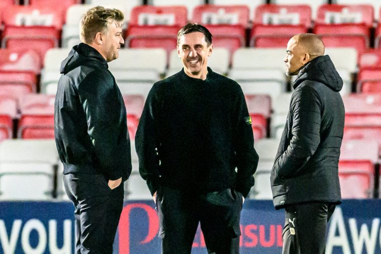 Karl Robinson, Head Coach of Salford City FC, Gary Neville, Co-owner of Salford City, and Kieron Dyer, Coach at Chesterfield, chat prior to the Sky Bet League 2 match between Salford City and Chesterfield at The Peninsula Stadium in Salford, England, on January 27, 2026. (Photo by Ian Charles/MI News/NurPhoto via Getty Images)