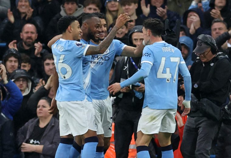 Manchester City's Ghanaian midfielder #42 Antoine Semenyo (2L) celebrates scoring the opening goal with Manchester City's Brazilian midfielder #26 Savinho (L), Manchester City's Egyptian striker #07 Omar Marmoush (C) and Manchester City's English midfielder #47 Phil Foden during the English Premier League football match between Manchester City and Crystal Palace at the Etihad Stadium in Manchester, north west England, on May 13, 2026. (Photo by Darren Staples / AFP via Getty Images) / RESTRICTED TO EDITORIAL USE. No use with unauthorized audio, video, data, fixture lists, club/league logos or 'live' services. Online in-match use limited to 120 images. An additional 40 images may be used in extra time. No video emulation. Social media in-match use limited to 120 images. An additional 40 images may be used in extra time. No use in betting publications, games or single club/league/player publications. /